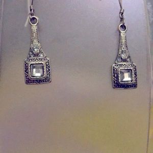 Silver dangly earrings.